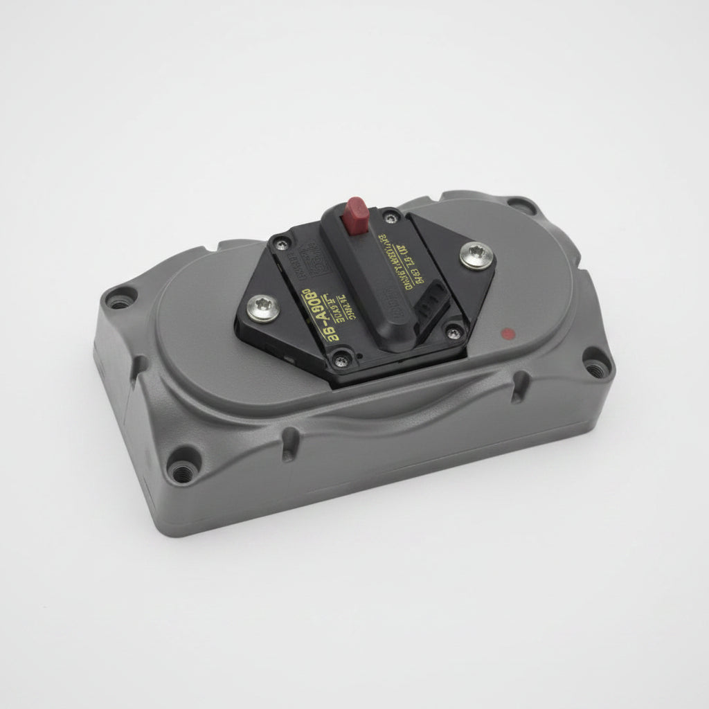 Gray electronic device with a red button on a white background