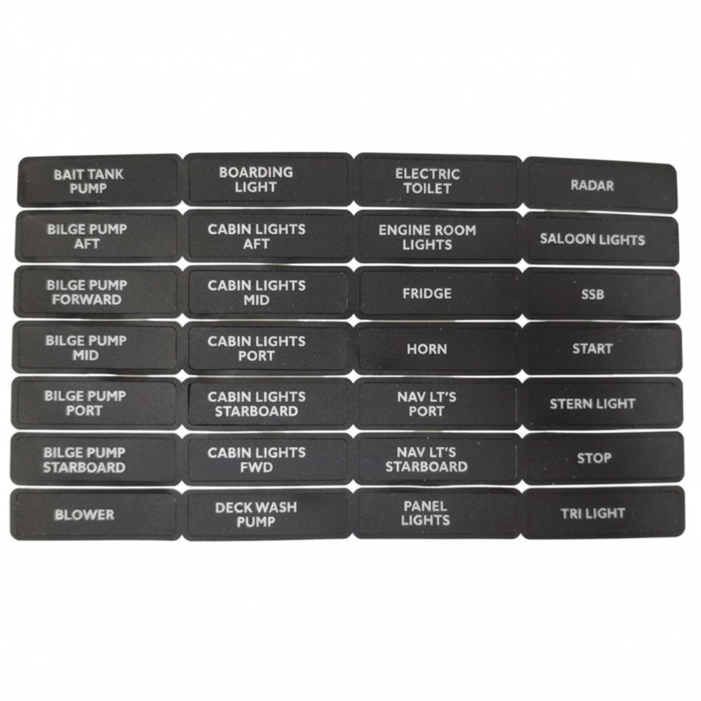 Set of black nameplates with various labels on a white background