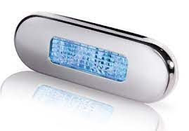 Hella Marine-2XT 959 680-611-LED OBLONG STEP LAMP WIDE RIM 10-33V BLUE - POLISHED 316 S/S BEZEL.